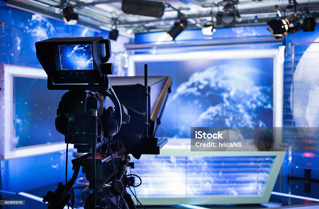 Video camera - recording show in TV studio Video camera - recording show in TV studio - focus on camera Television Studio Stock Photo