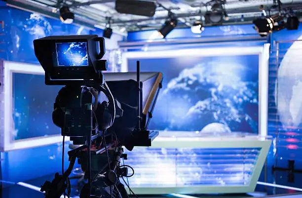 Video camera - recording show in TV studio - focus on camera