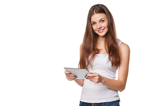 istock Attractive smiling girl using tablet. Woman with tablet pc, isolated 503592270