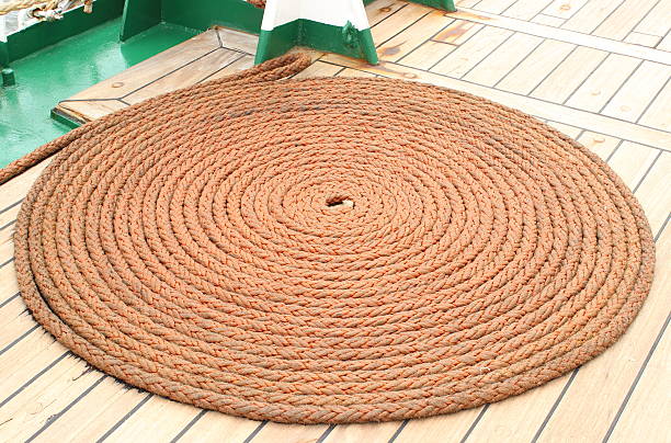 istock Thick rope wrapped in spiral lying on deck of ship 503596985