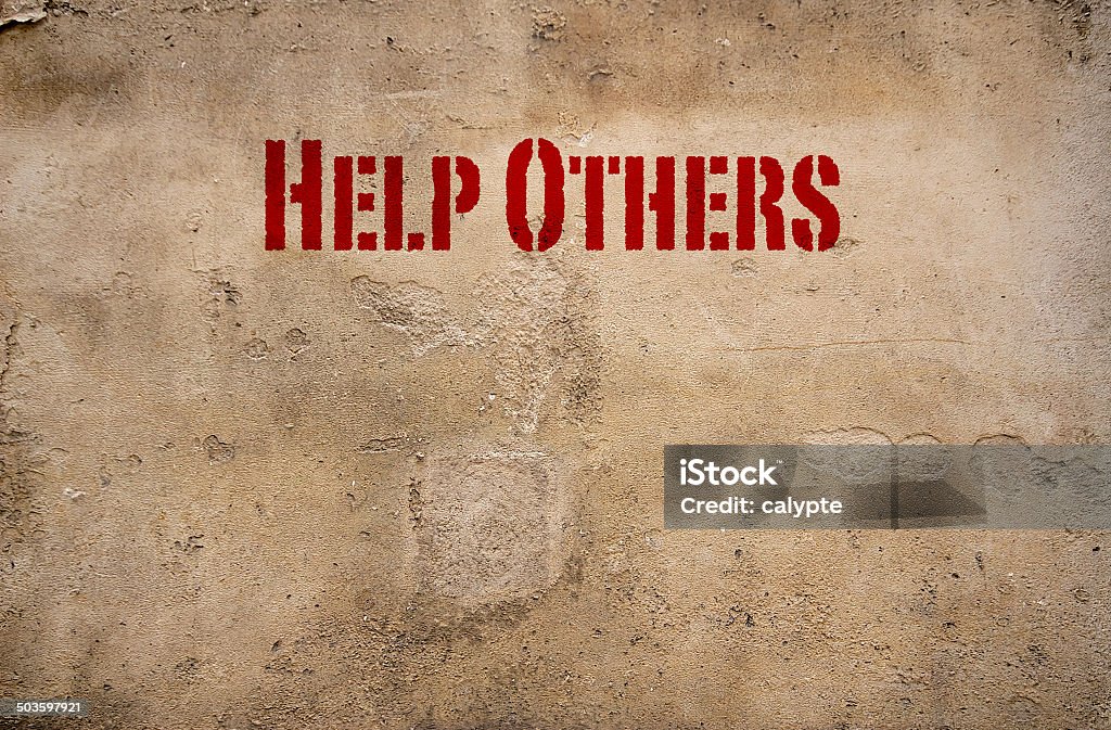 Offering Help Signs Help Others Sign On A Concrete Wall Stock Photo - Download Image Now ...