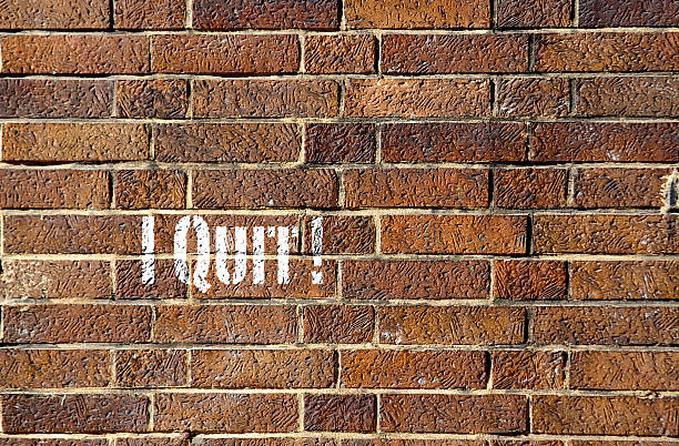 istock I Quit sign on a brick wall 503597929