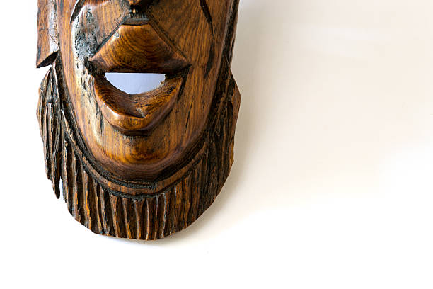 istock Wooden african mask on a white paper 503598981
