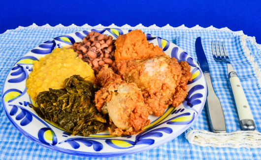 Soul Food supper in blue gingham Southern Cooking setting.