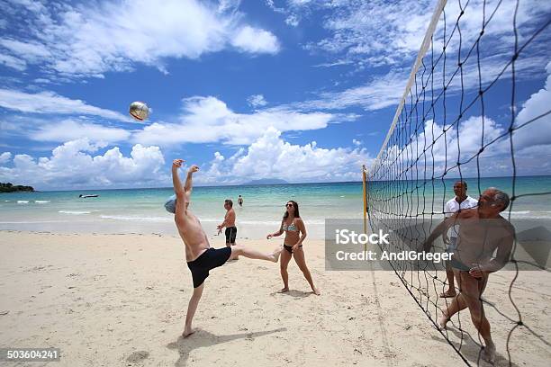 Group Of Friends Plays Volleyball On The Beach Stock Photo - Download Image Now - Activity, Adult, Adults Only