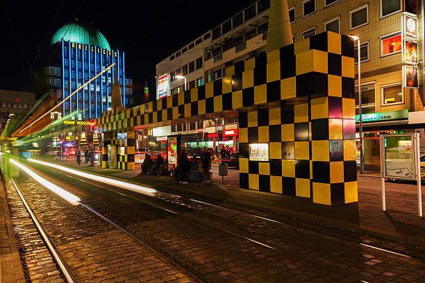 Hanover, Germany - December 03, 2015: artistic tram shelter at Steintor in Hanover with unidentified people. It is a city art project with 10 shelters. This one was designed by Alessandro Mendini 