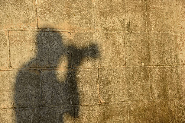 istock silhouette of photographer on wall 503611878