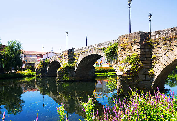 istock stone bridge at Monforte de Lemos in summer 503612956