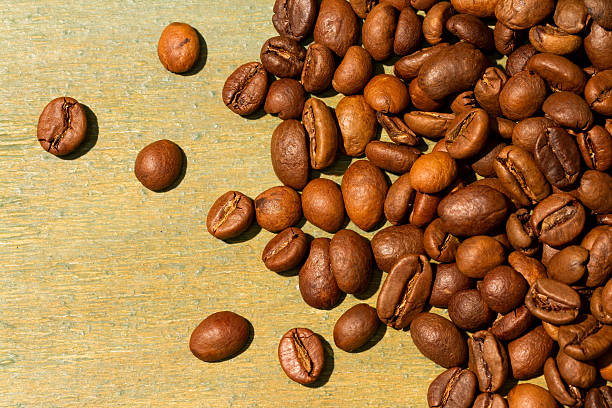istock Coffee beans on wood background 503614914