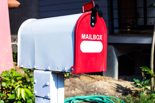 istock Red and white Mail Box in Front of a House 503616068