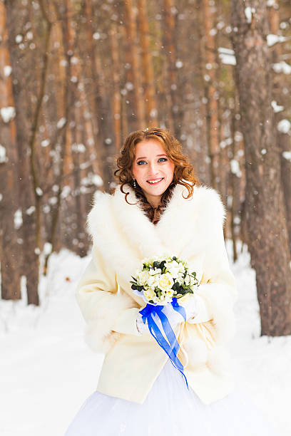 istock Bride and bridal bouquet in the winter 503619836