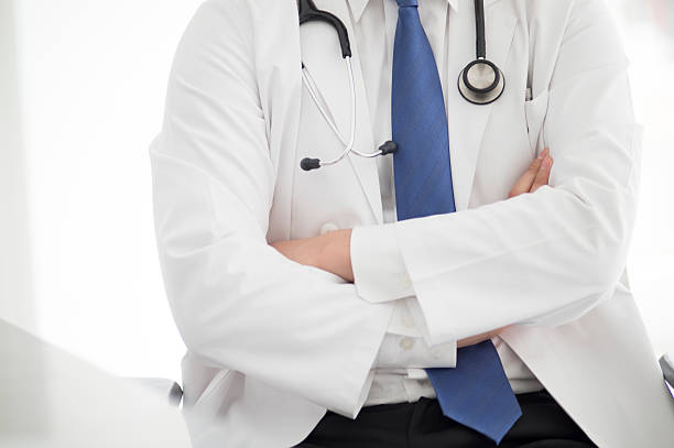 istock Doctor sitting with his arms folded 503622258
