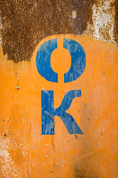 Stencil Letters OK n a rusty surface stock photo