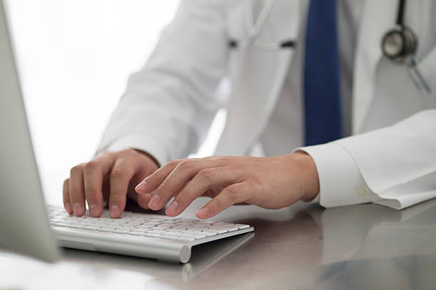 istock Doctor to operate the personal computer in the office 503625626
