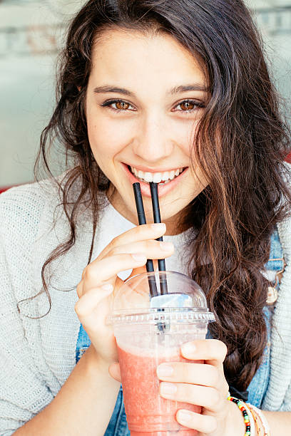 istock Beautiful girl drinking a smoothie 503626123