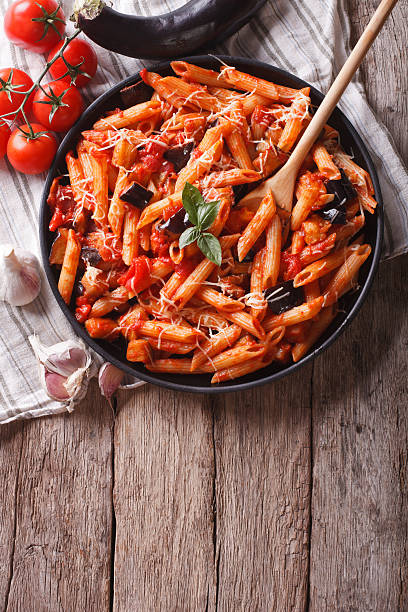 istock Italian food: Pasta alla Norma and ingredients. vertical top vie 503626756