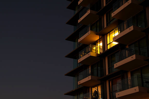 istock Yellow Light from apartment Room at night background 503632894