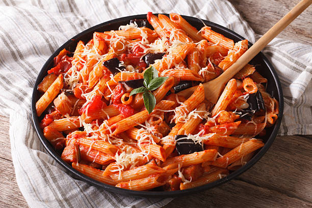 istock Penne with eggplant and tomatoes close-up. horizontal 503633532