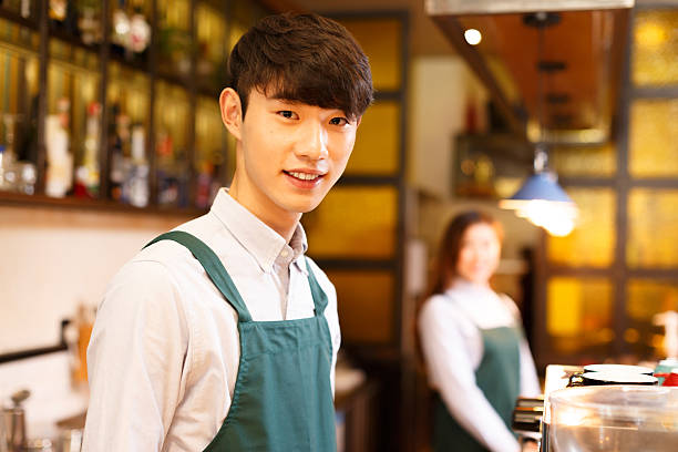 istock portrait waitress and waiter in cafe 503633576