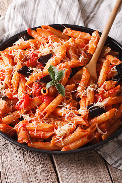 istock Pasta alla Norma with eggplant and tomatoes close-up. vertical 503633694