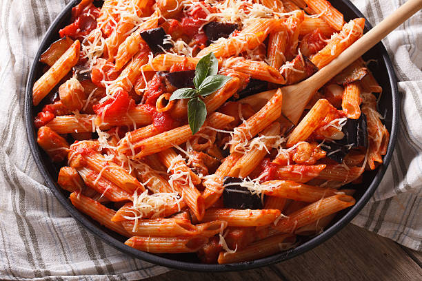 istock Pasta alla Norma. Penne with eggplant and tomatoes horizontal 503634132