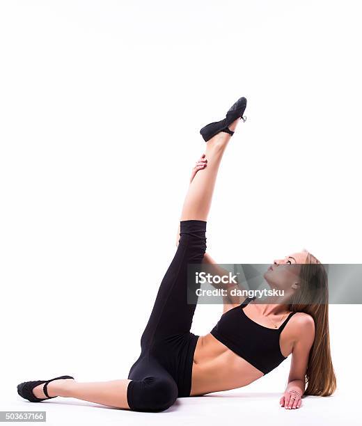 Young Woman Doing Gymnastic Exercise Stock Photo - Download Image Now - Acrobatic Activity, Active Lifestyle, Adult