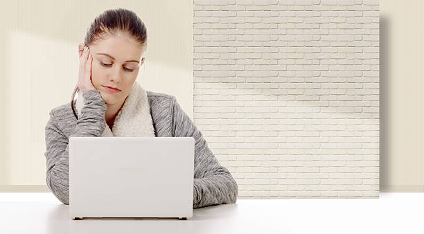 istock young woman working with a white laptop 503637496