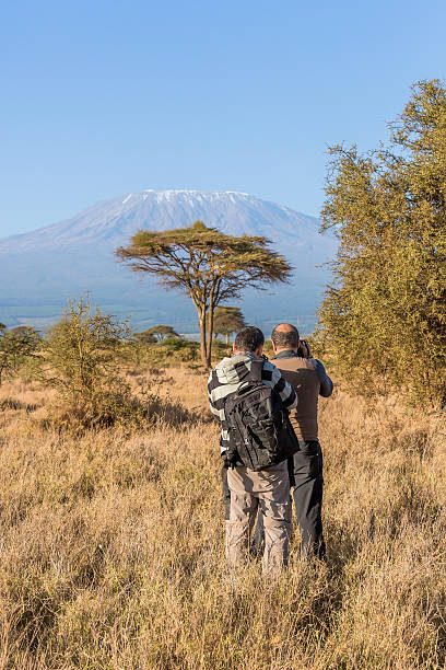 istock Photographer at Mt Kilimanjaro with Acacia Trees 503640324