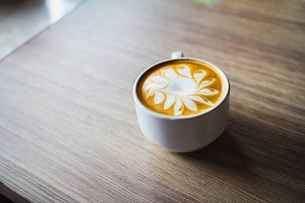 istock Latte art coffee cup on wood table 503640718