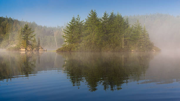 Mist over a Lake Mist over a Lake boundary waters canoe area stock pictures, royalty-free photos & images