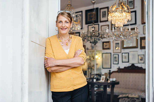 Portrait of an owner of a Vintage shop smiling with arms crossed