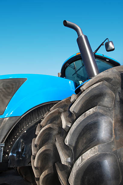 istock Tire on blue tractor close up 503656398