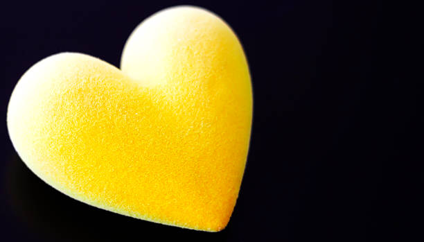istock Yellow fluffy heart on a black background 503660312