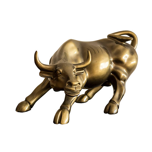 Brass Miniature Bull Reproduction Brass Miniature Bull souvenir on white background wall street lower manhattan stock pictures, royalty-free photos & images