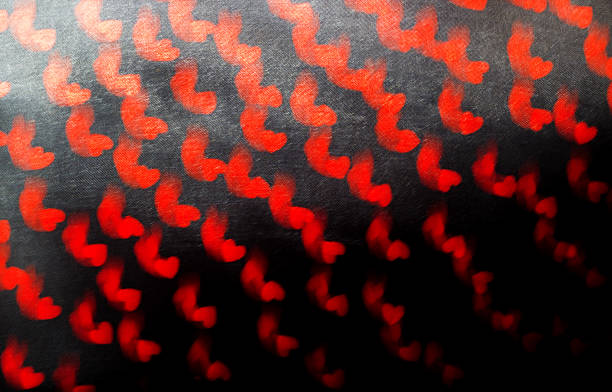 istock Black background with red hearts, natural blurred 503662558