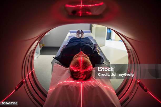 Patient Lying Inside A Medical Scanner In Hospital Stock Photo - Download Image Now - MRI Scan, MRI Scanner, CAT Scan