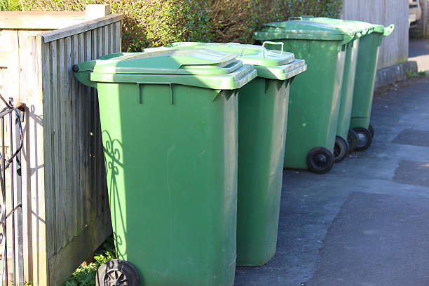 istock Image of wheelie-bins / dustbins in row, waiting for refuse collection 503663836