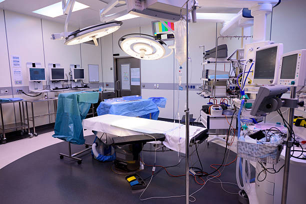 istock Operating theatre with empty bed and medical equipment 503664732