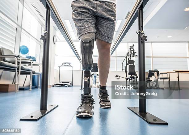 Man With Prosthetic Leg Using Parallel Bars Stock Photo - Download Image Now - Prosthetic Equipment, Amputee, Physical Therapy