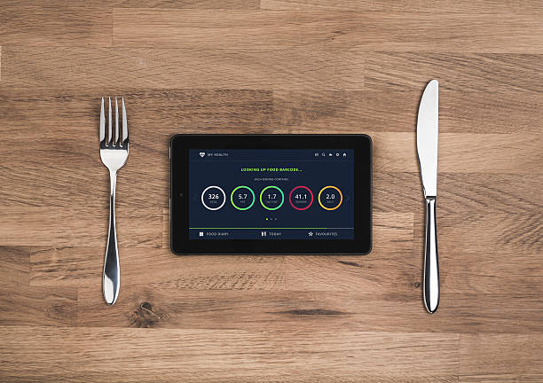 Food nutrition information on mobile tablet stock photo
