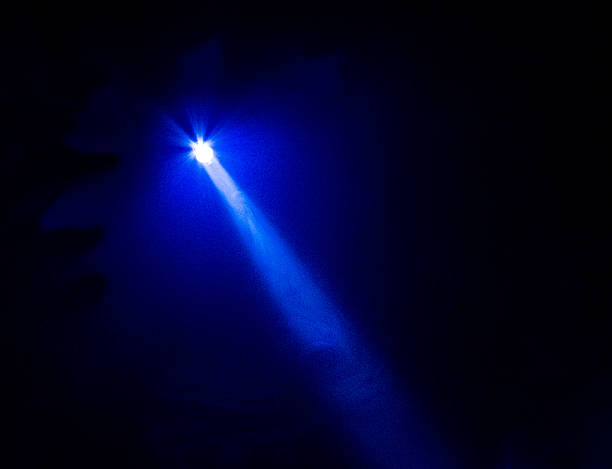 Bright Blue Flashlight Beam Super bright blue beam with star light pattern around source with black background. Could be used for search light, spot light, theatre light, LED flashlight, or any other abstract bright light idea. searchlight photos stock pictures, royalty-free photos & images