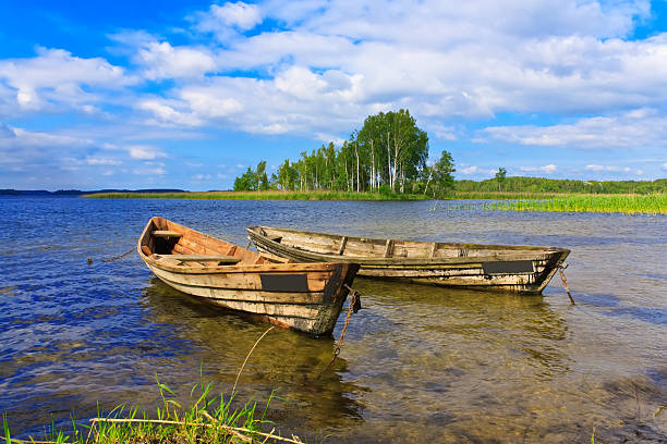 istock Two boats on the lake on blue sky background 503670513