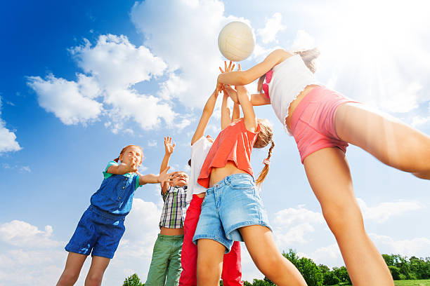 istock Group of children plays ball on a meadow 503670637