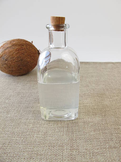 Liquid coconut oil Liquid coconut oil - Flüssiges Kokosöl palmin photos stock pictures, royalty-free photos & images