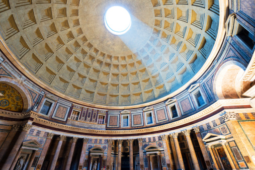 Rome, Italy. June 26, 2021. Low angle view of light beam falling through oculus of ancient Pantheon's dome in Rome, Italy