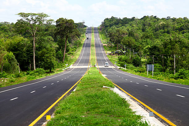 istock road and perfect green field 503675687