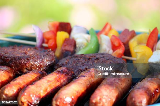Kettle Charcoal Barbecue Bbq In Garden Sausages Burgers Kebabs Image Stock Photo - Download Image Now