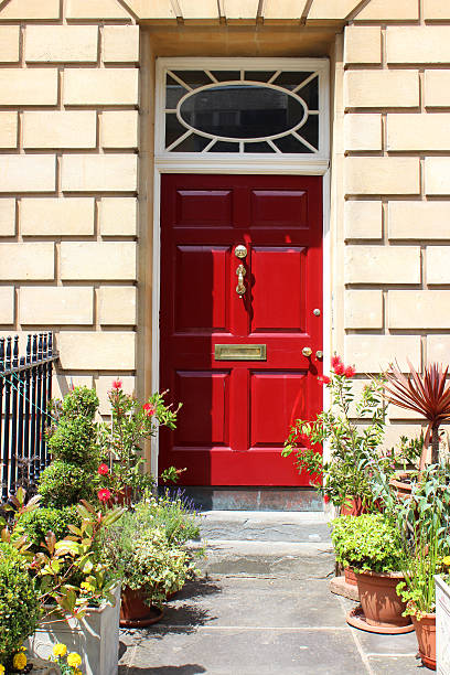 istock Image of red front door with Georgian surround, Bath stone 503677583