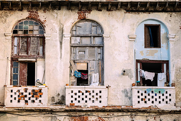 Architecture of old and ruined Havana, Cuba. Balconies on building in rough shape after years of neglect and lack of renovation.