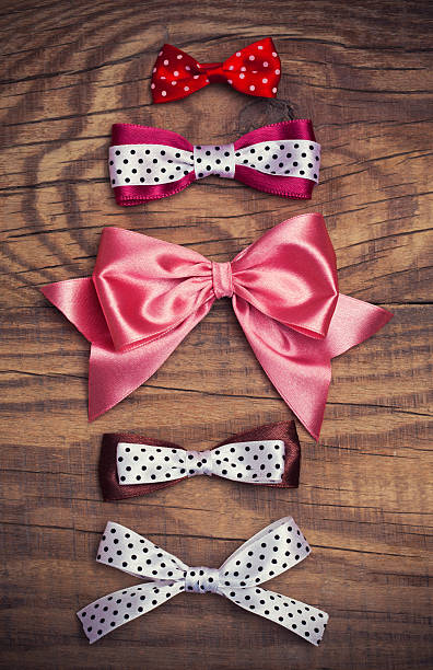 istock colorful bows on wooden background 503678005
